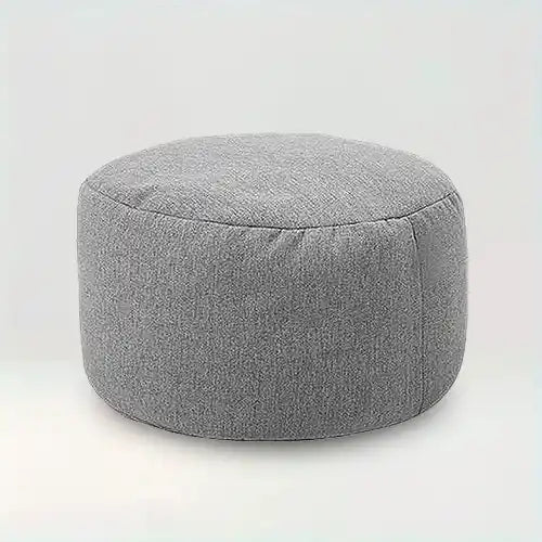 Housse de pouf rond en tissu Assia de couleur gris foncé sur fond beige