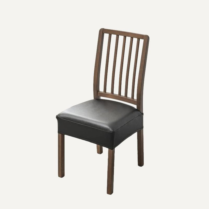 Housse de siège de chaise effet cuir imperméable Arielle de couleur noir sur fond beige