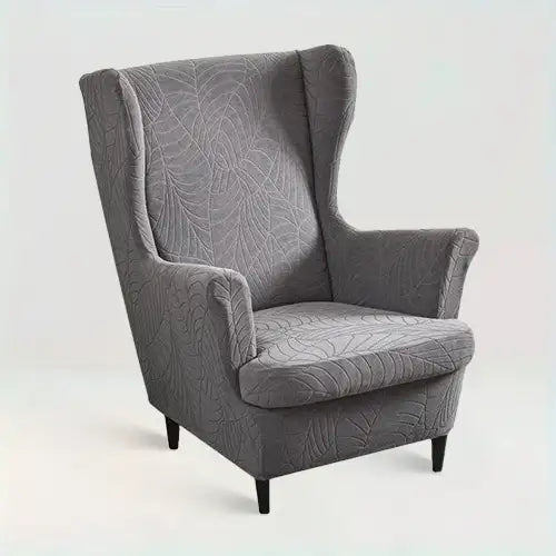 Housse de fauteuil à oreilles en jacquard effet floral Laurena de couleur gris foncé sur fond beige