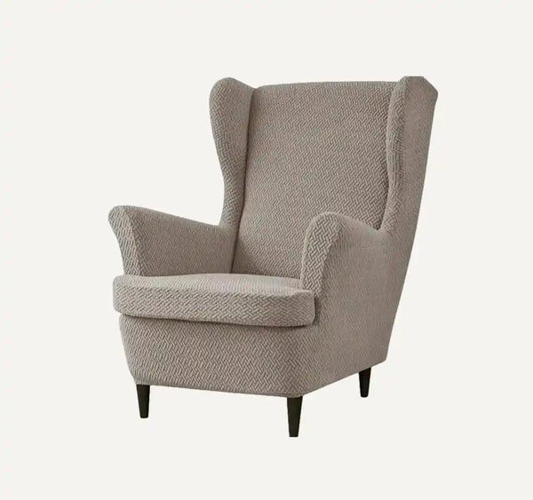 Housse de fauteuil à oreilles en jacquard effet tressé Leolia de couleur taupe sur fond beige