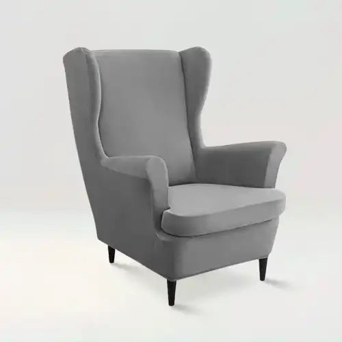 Housse de fauteuil à oreilles en velours Zina de couleur gris sur fond beige