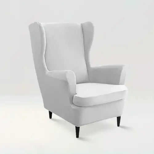 Housse de fauteuil à oreilles en velours Zina de couleur gris clair sur fond beige