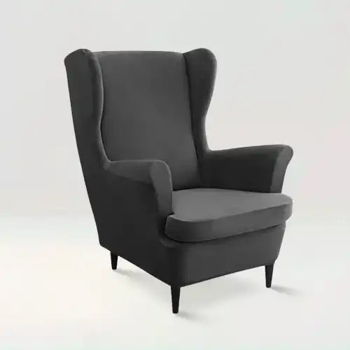 Housse de fauteuil à oreilles en velours Zina de couleur noir sur fond beige